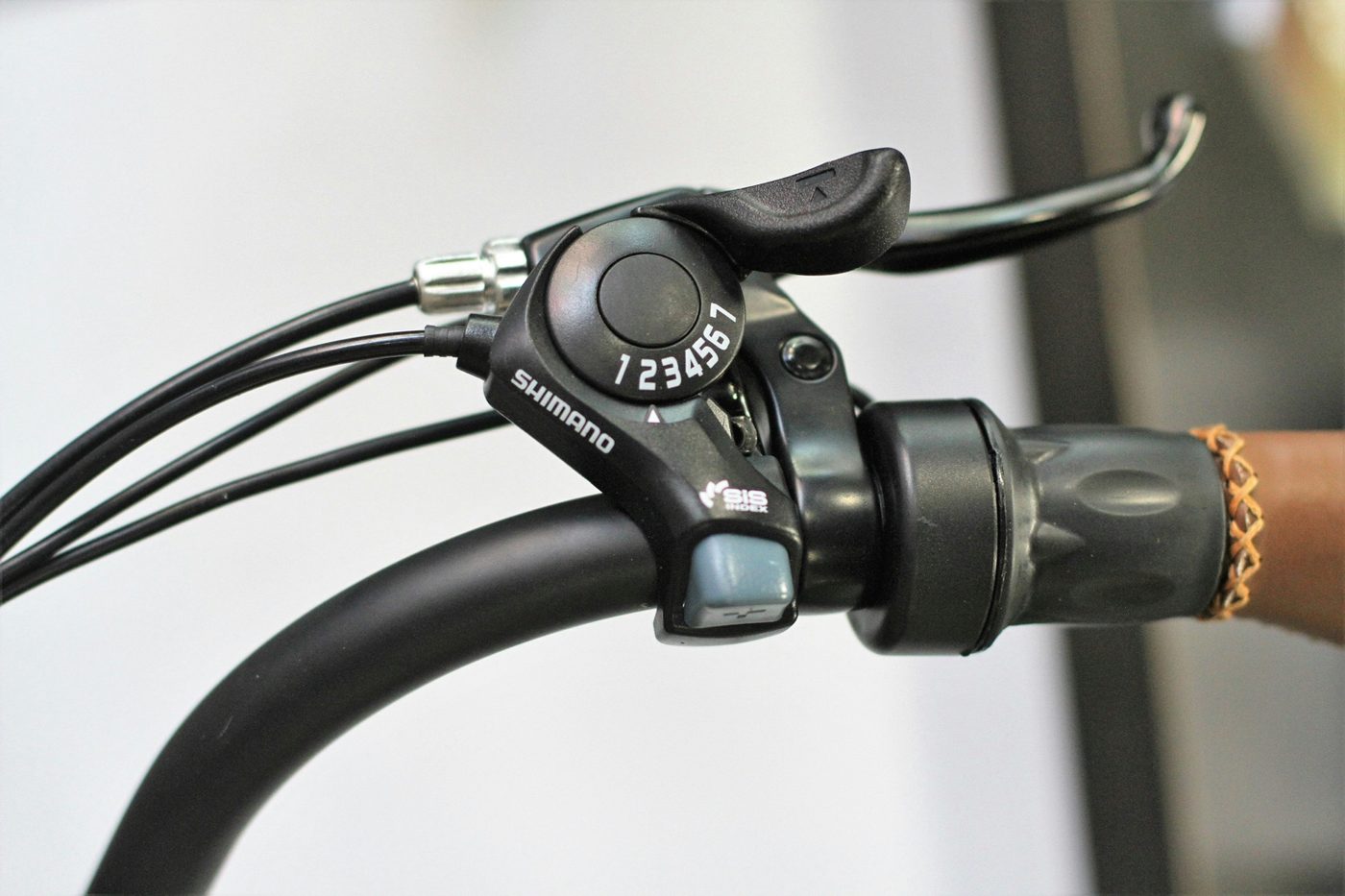 7-speed shifter close-up on an e-bike handlebar